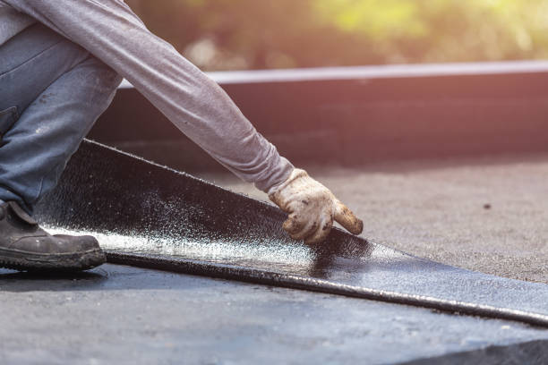 Professional Basement Waterproofing technician working in Rushford, NY